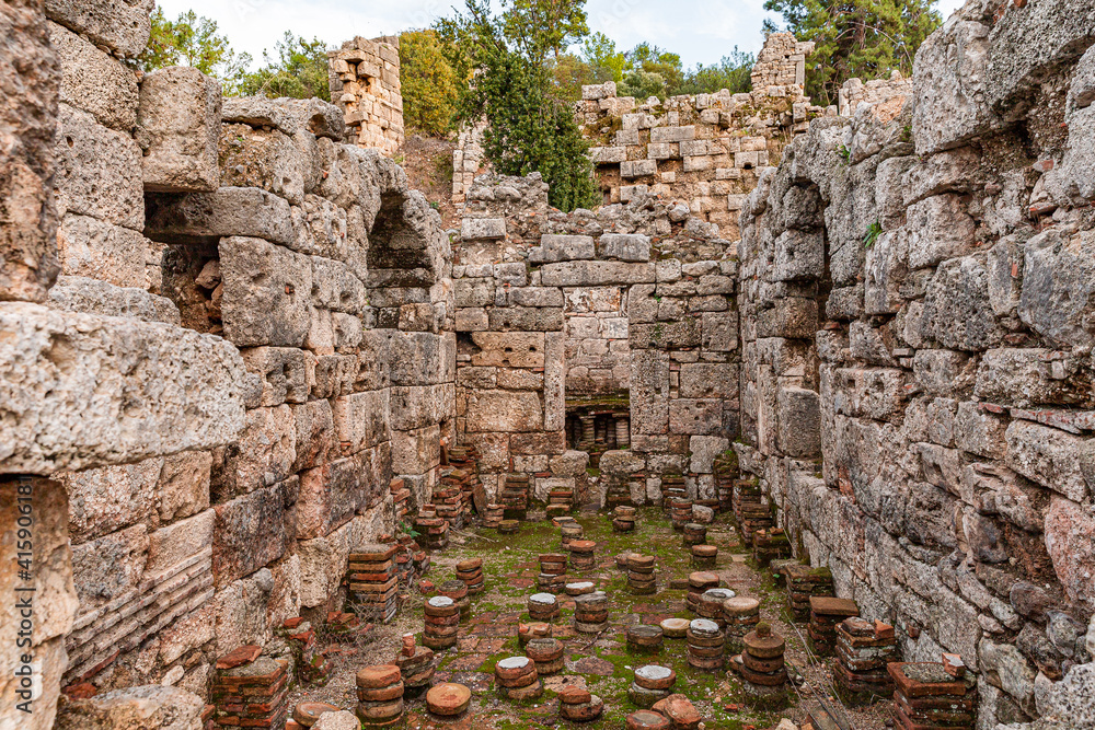 Part of residential building in historical city of Olympus, Byzantine period. Amazing nature and antique city ruins. Ruins of an ancient city in Lycia, near village of Cirali, 70 km from Antalya.