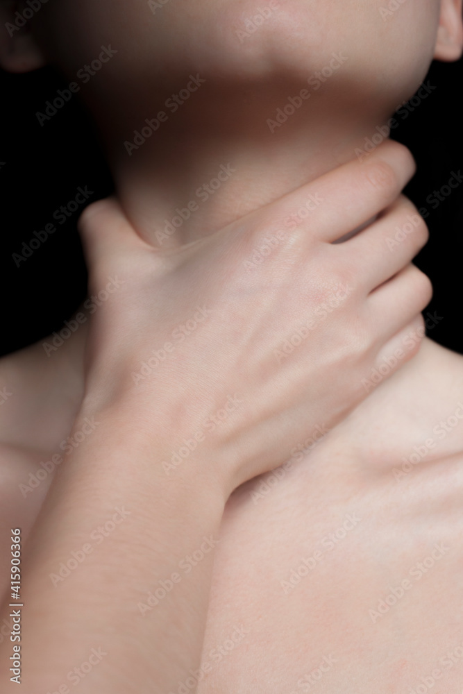 Woman neck and chin. A hand compressing  a woman’s neck.