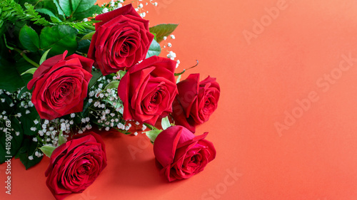 Nice red roses bouquet on the deep pink background closeup  banner. Greeting card design for Womens day  Mother s day or Valentine s day.