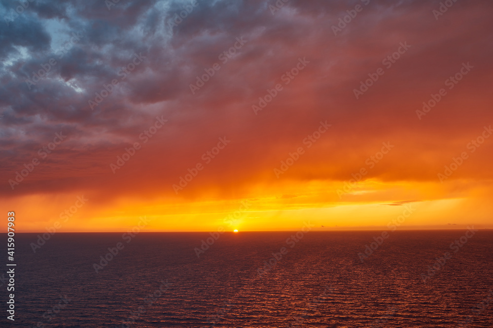 Dramatic sunset over the Mediterranean.  Distant rain