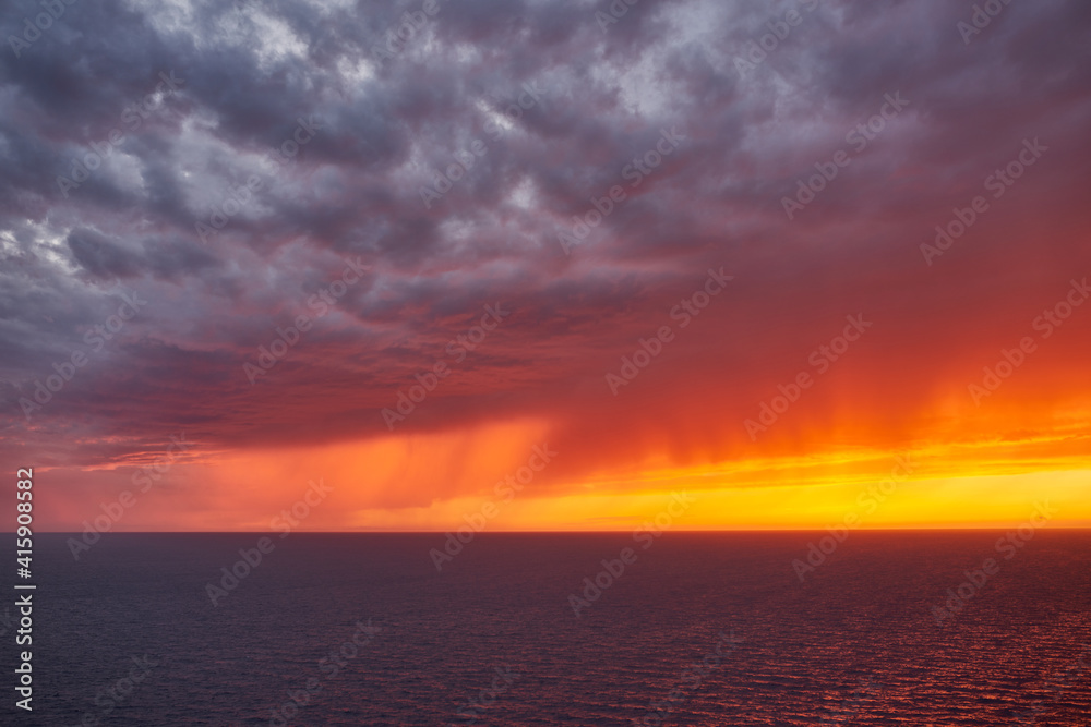 Dramatic sunset over the Mediterranean.  Distant rain