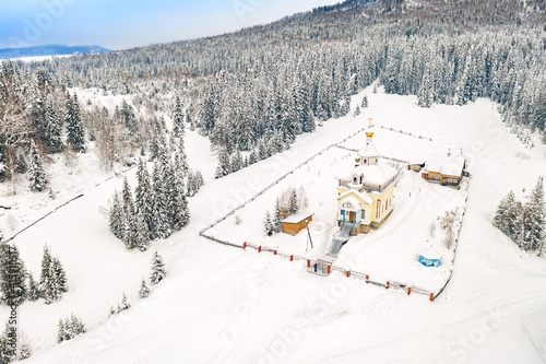 Aerial drone view of the Church in Choya, Altai Republic during winter