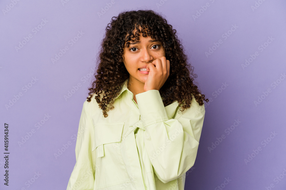 Young african american afro woman isolated biting fingernails, nervous and very anxious. Young african american afro woman isolated biting fingernails, nervous and very anxious.