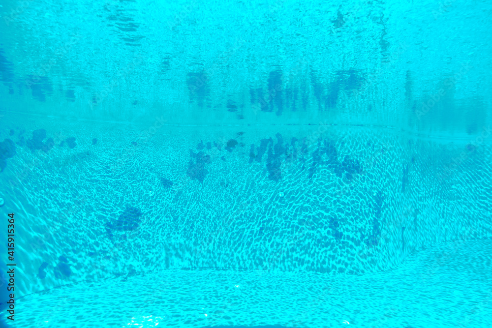 Inside the very clean and turquoise color swimming pool