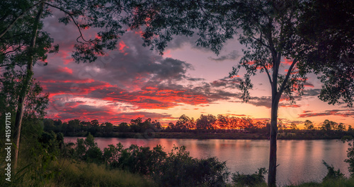 Beautiful Panoramic Riverside Sunset with Dramatic Sky and Reflections