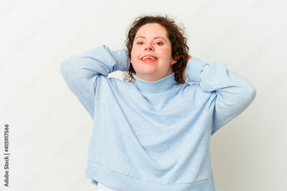 Woman with Down syndrome isolated feeling confident, with hands behind the head. Woman with Down syndrome isolated feeling confident, with hands behind the head.