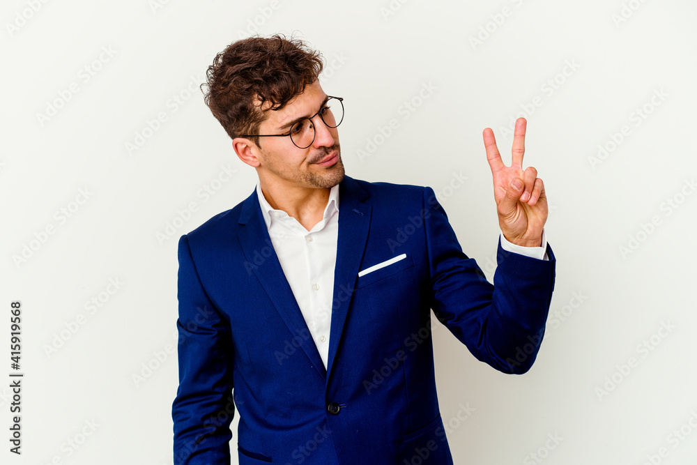 Young business caucasian man isolated on white background joyful and carefree showing a peace symbol with fingers. Young business caucasian man isolated on white background joyful and carefree showing a peace symbol with fingers.
