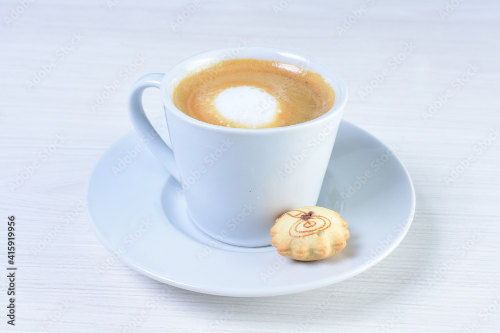 Cup of colombian coffee, decorated on white wooden background Cup of colombian coffee, decorated on white wooden background