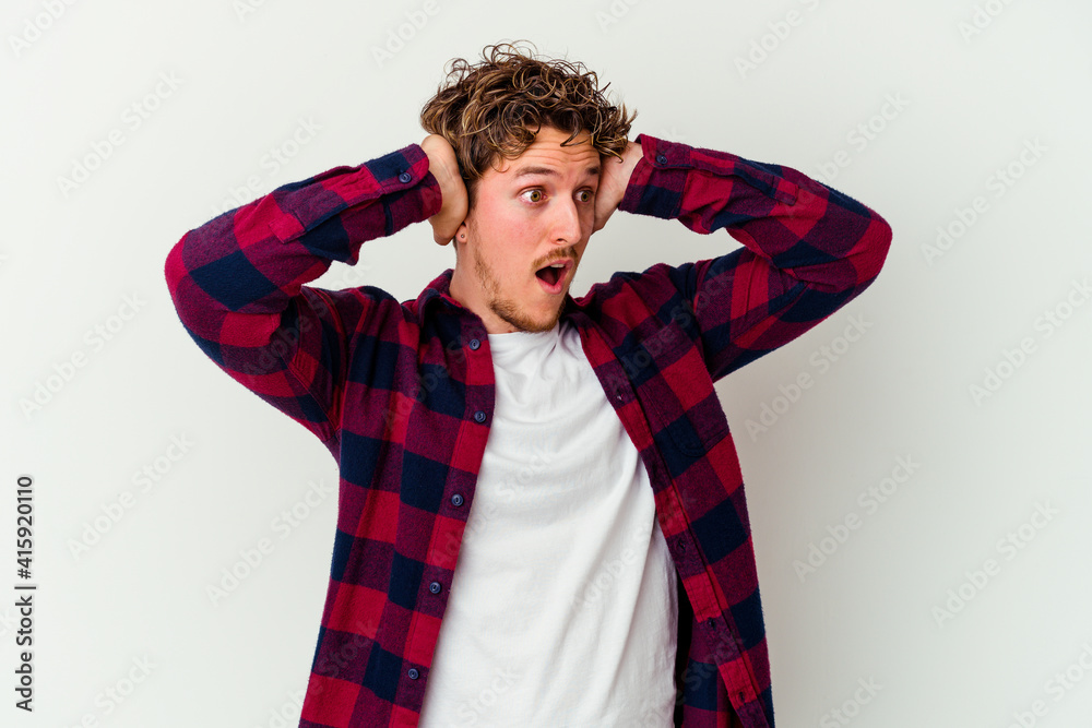 Young caucasian man isolated on white background screaming, very excited, passionate, satisfied with something. Young caucasian man isolated on white background screaming, very excited, passionate, satisfied with something.