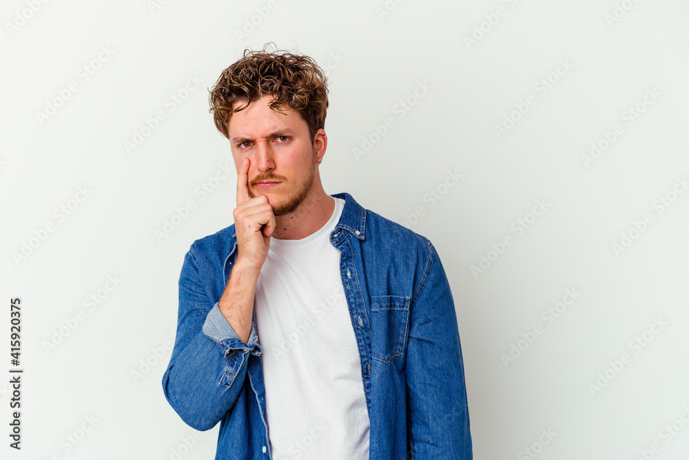 Young caucasian man isolated on white background contemplating, planning a strategy, thinking about the way of a business. Young caucasian man isolated on white background contemplating, planning a strategy, thinking about the way of a business.