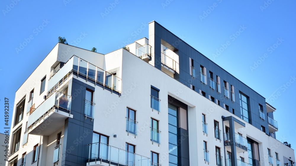 Condominium and apartment building with  symmetrical modern architecture in the city downtown.