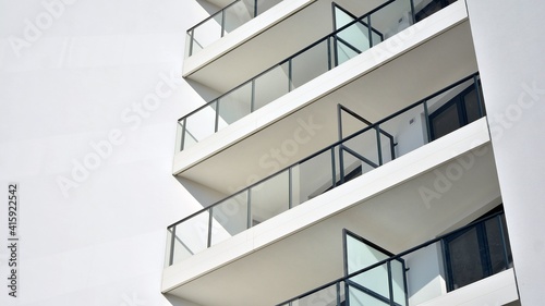 Condominium and apartment building with symmetrical modern architecture in the city downtown.