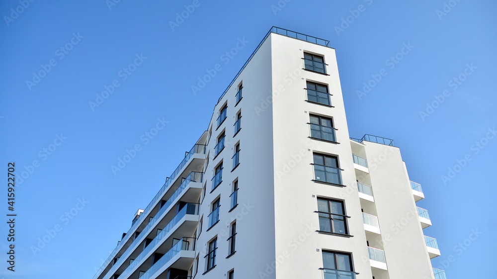 Condominium and apartment building with symmetrical modern architecture in the city downtown. Condominium and apartment building with symmetrical modern architecture in the city downtown.