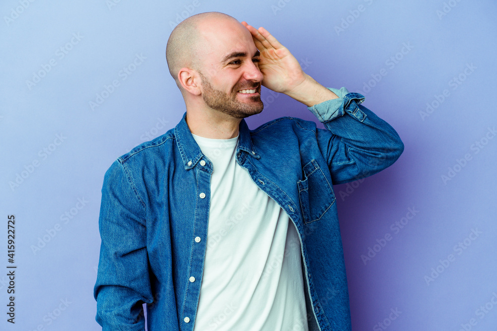 Young caucasian bald man isolated on purple background joyful laughing a lot. Happiness concept. Young caucasian bald man isolated on purple background joyful laughing a lot. Happiness concept.