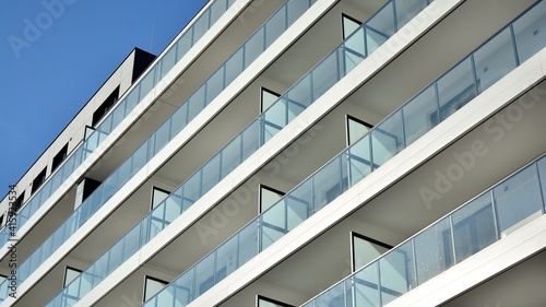 Condominium and apartment building with symmetrical modern architecture in the city downtown.