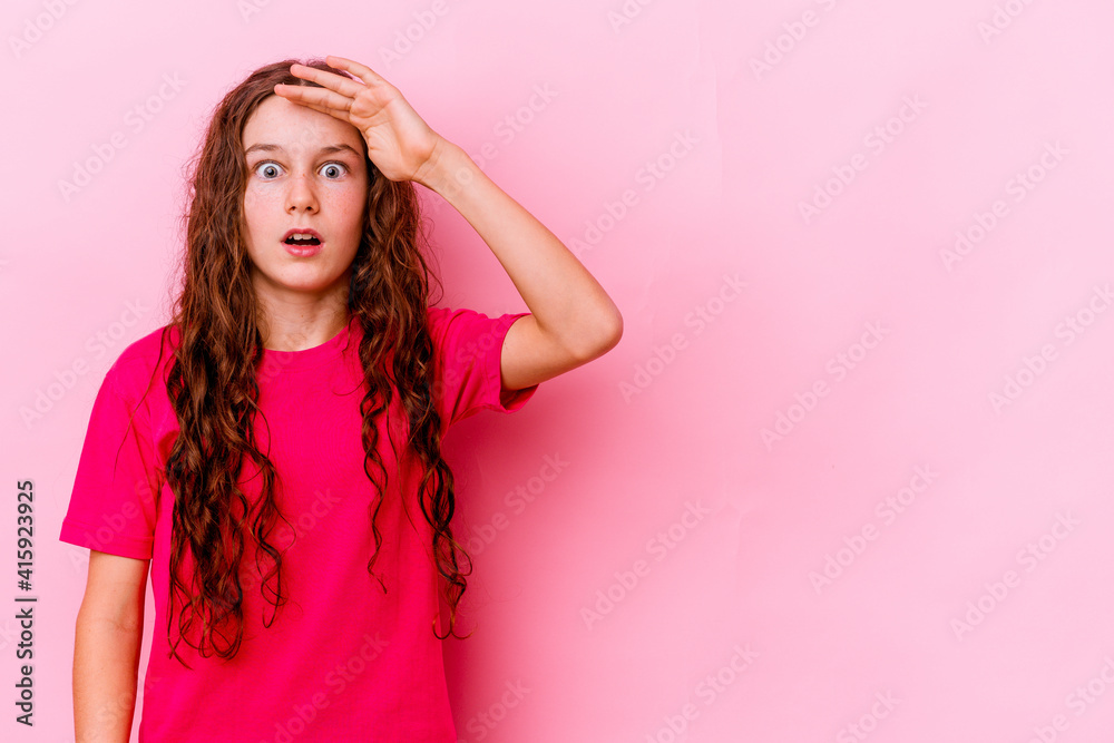 Little caucasian girl isolated on pink background shouts loud, keeps eyes opened and hands tense. Little caucasian girl isolated on pink background shouts loud, keeps eyes opened and hands tense.