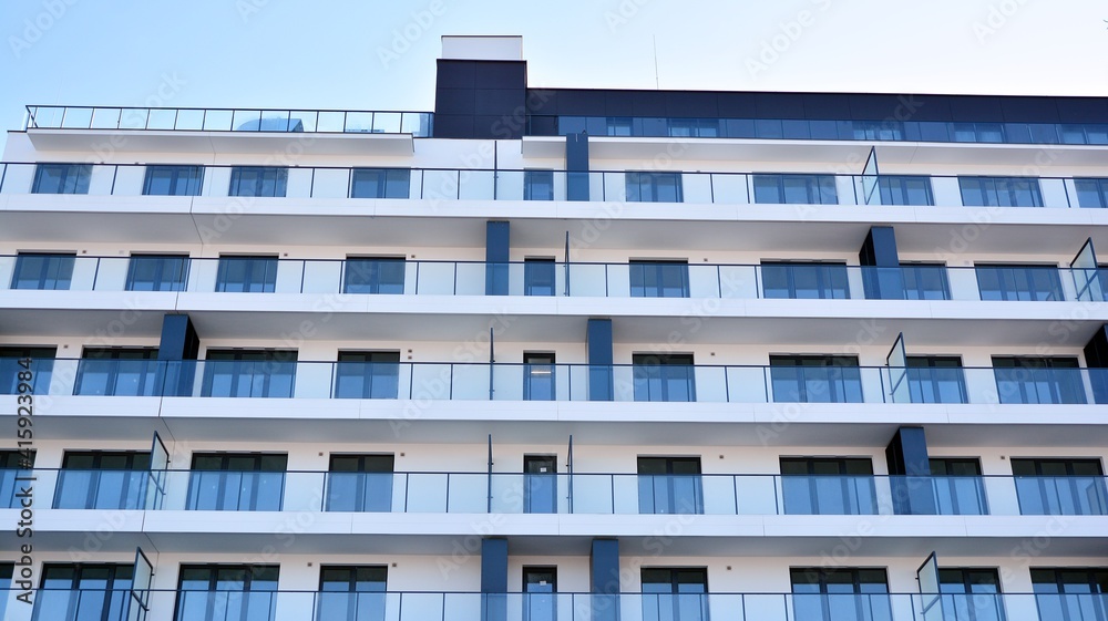 Condominium and apartment building with symmetrical modern architecture in the city downtown. Condominium and apartment building with symmetrical modern architecture in the city downtown.