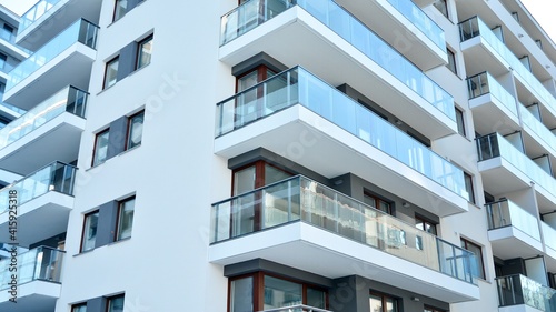 Condominium and apartment building with symmetrical modern architecture in the city downtown.