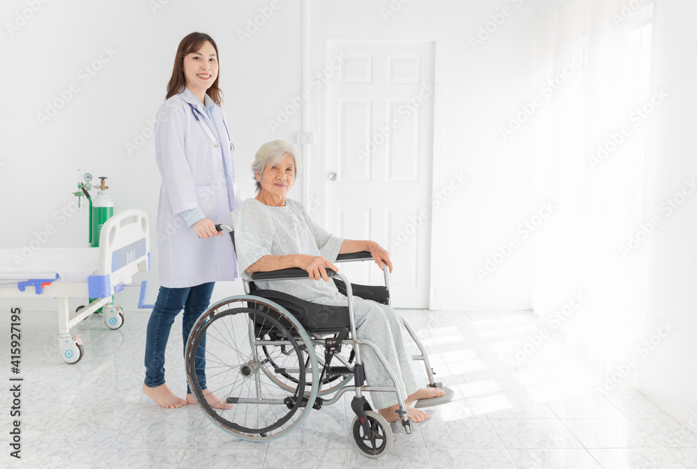 close up patient, Asian doctor drive a wheelchair of old patient, doctor and old female talk about disease symptoms and treatment plan, happy hospital, elderly healthcare promotion close up patient, Asian doctor drive a wheelchair of old patient, doctor and old female talk about disease symptoms and treatment plan, happy hospital, elderly healthcare promotion