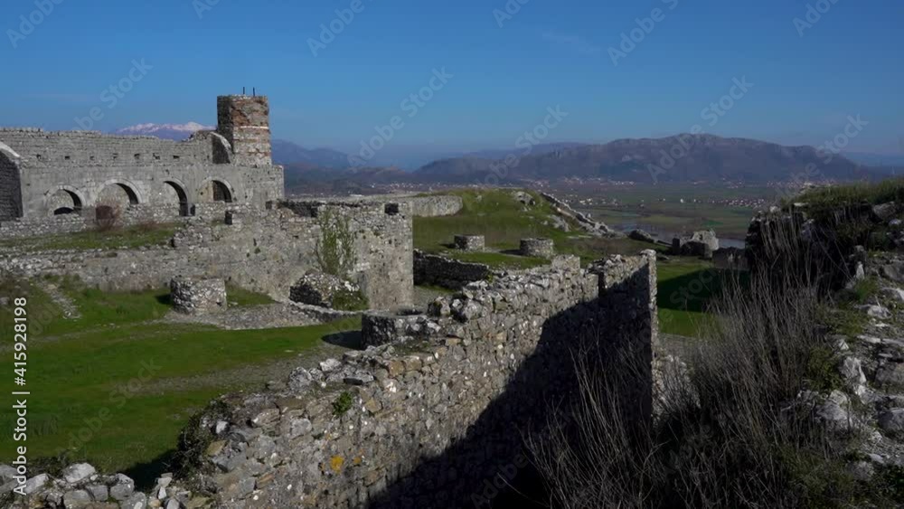 Ancient stone walls of Rozafa castle and ruined buildings inside the fortress