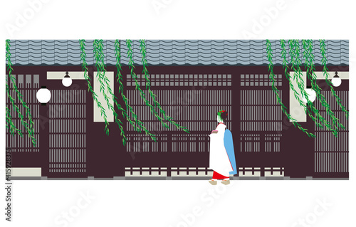 日本の古い町屋の建物としだれ柳と少女
