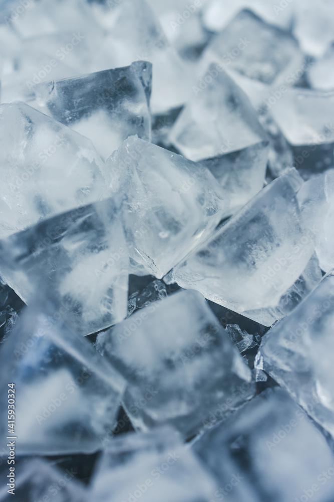 close-up of ice cubes in freezer tray with cold blue tones close-up of ice cubes in freezer tray with cold blue tones