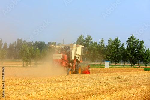 combine harvester working on a wheat field