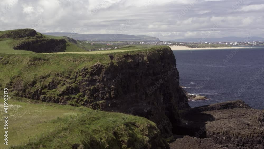 Whiterocks beach and Dunluce on the Causeway Coastal Route, Northern Ireland. Whiterocks beach and Dunluce on the Causeway Coastal Route, Northern Ireland.