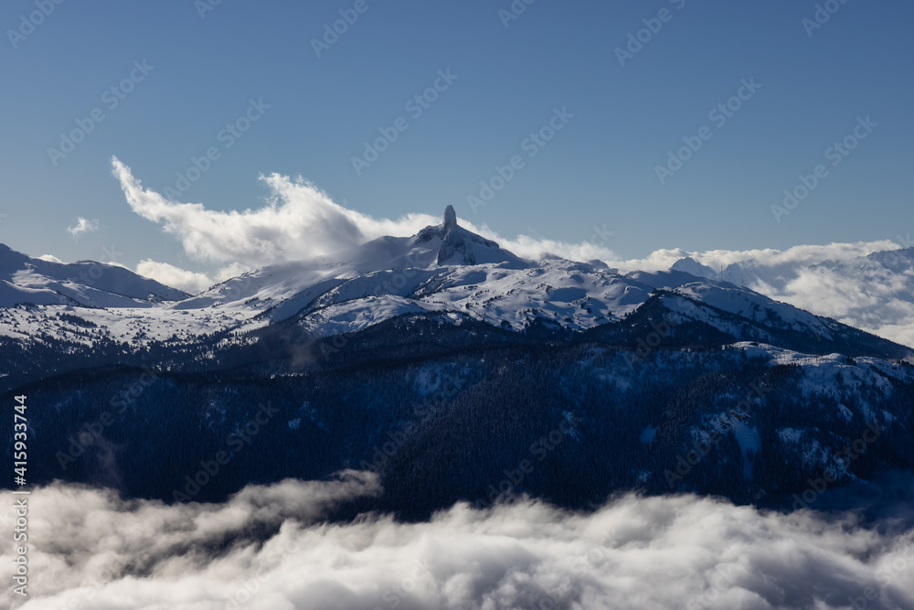 Beautiful View of Black Tusk and Canadian Nature Landscape covered in Snow during winter. Taken on top of Whistler Mountain, British Columbia, Canada. Nature Background