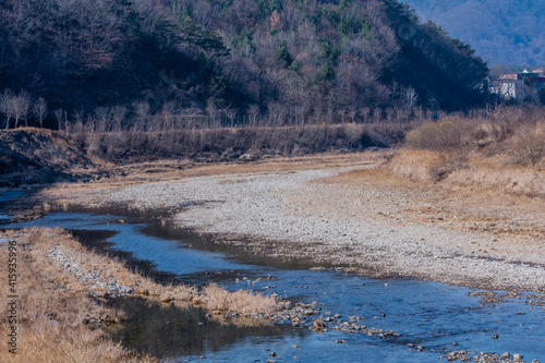 Dry rocky riverbed in rural countryside