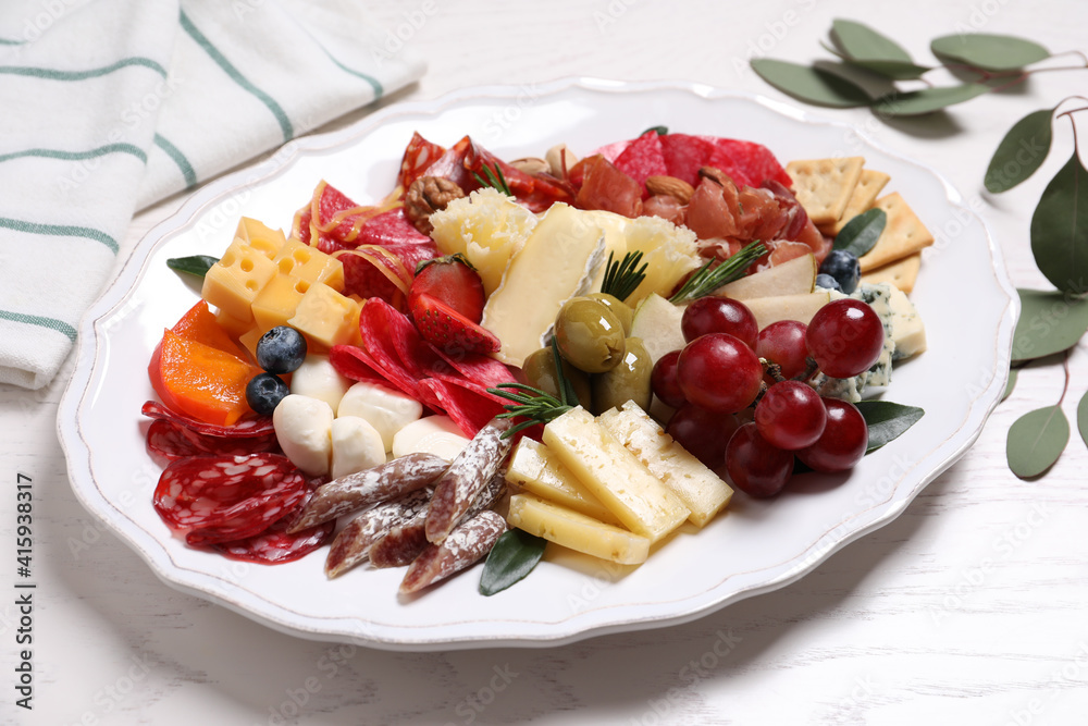 Tasty assorted appetizers served on white wooden table Tasty assorted appetizers served on white wooden table
