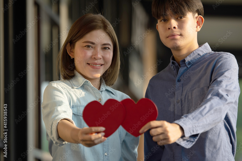 Asian couple holding red heart ,People happy sweet love Valentine, health  insurance , Giving Love together