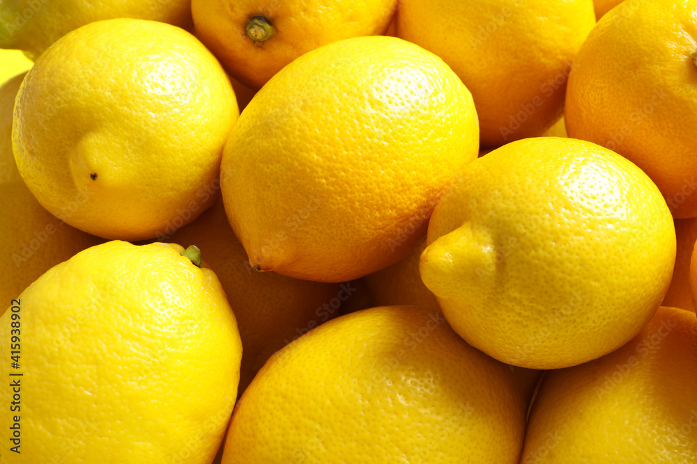 Many fresh ripe lemons as background, closeup Many fresh ripe lemons as background, closeup