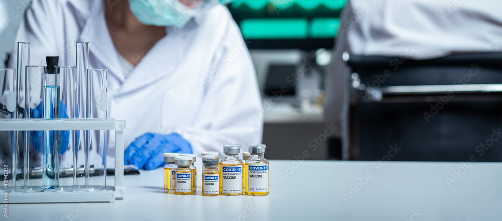 Group of researchers testing Coronavirus vaccine for using with human. Group of researchers testing Coronavirus vaccine for using with human.