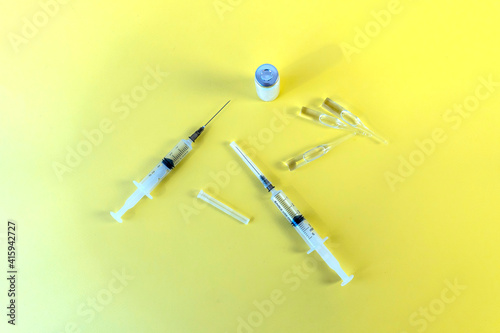 Flat Lay on medicine and healthcare. Treatment of patients and vaccination from coronavirus. Syringes, dropper, ampoules.