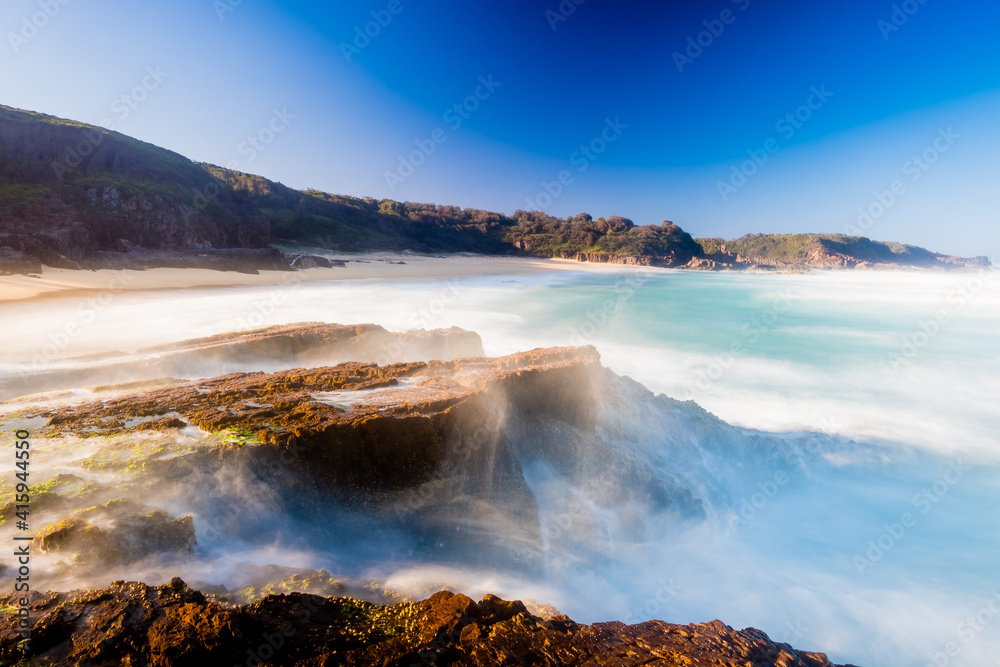 Obraz premium Coastline along Bingie Beach in Eurobodalla National Park