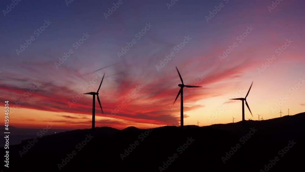 Silhouette of Wind Turbines, Renewable Energy, Mountain landscape , Aerial View during sunset and colored sky.
Silhouette of Wind Turbines, Renewable Energy, Mountain landscape , Aerial View during sunset and colored sky.
