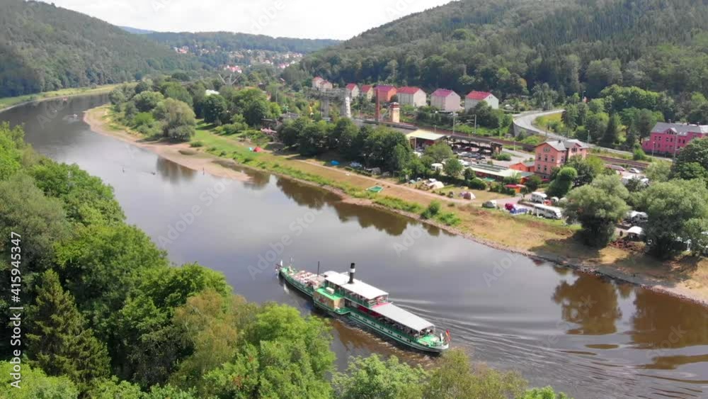 Aerial View of boat trip on a river with mountains, trees, vacation, adventure, ship, steamship Aerial View of boat trip on a river with mountains, trees, vacation, adventure, ship, steamship