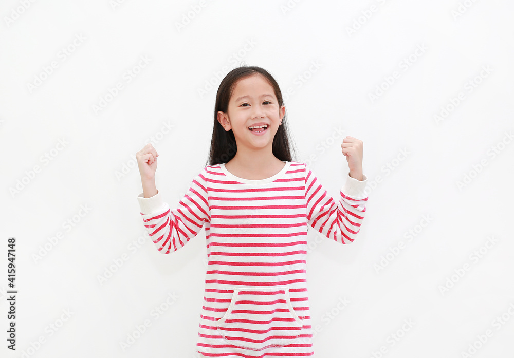 Happy kid gesture Strong. Asian little girl raising punch up isolated on white background. Happy kid gesture Strong. Asian little girl raising punch up isolated on white background.