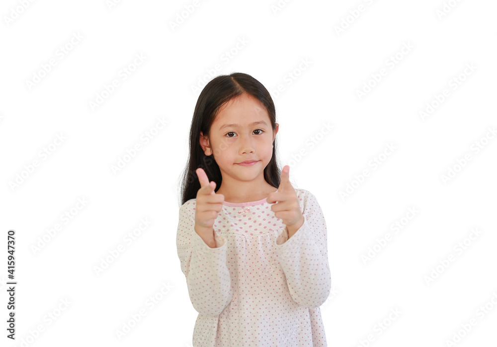 Cute Asian little child girl child pointing at you and looking camera isolated on blue background. Kid point two index fingers to front Cute Asian little child girl child pointing at you and looking camera isolated on blue background. Kid point two index fingers to front