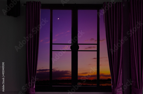 Beautiful evening sky in the window view of house