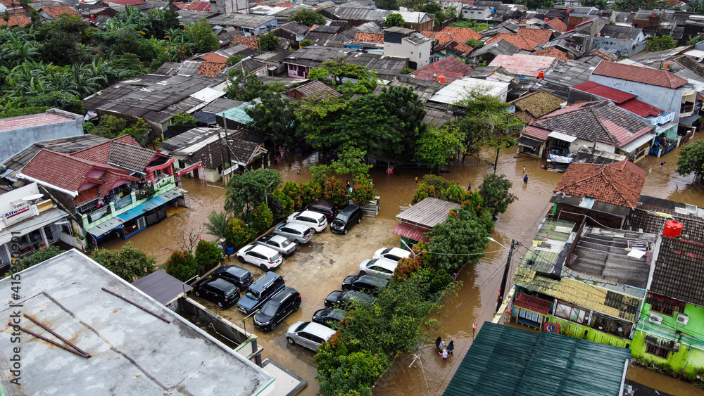 Fototapeta premium Aerial POV view Depiction of flooding. devastation wrought after massive natural disasters. BEKASI, WEST JAVA, INDONESIA. FEBRUARY 23, 2021