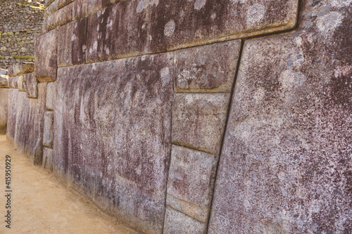 A close up of a inca stone wall from Machu Picchu temple