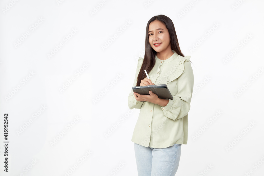 Beautiful young woman holding digital tablet and looking at camera with smile while standing. Wireless technology. Beautiful young woman holding digital tablet and looking at camera with smile while standing. Wireless technology.