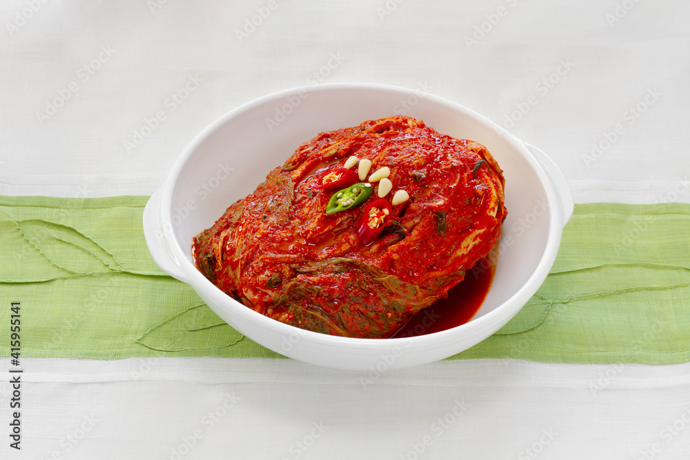 The most famous Korean food Kimchi(napa cabbage) and chopsticks on traditional patchwork background. Front view.
The most famous Korean food Kimchi(napa cabbage) and chopsticks on traditional patchwork background. Front view.