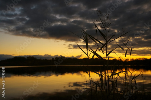 Beautiful sunset on the lake shore © kichigin19