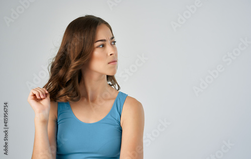 woman in blue t-shirt attractive happy mood gray background