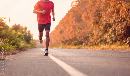 man runner athlete on the road to healthy, Young people running exercise on street.