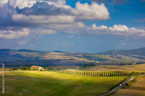 Sunny Tuscany landscape - beautiful hills and sky with clouds