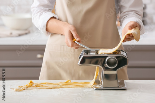 Woman making pasta with mac...
